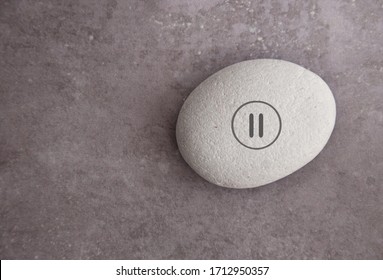 Yoga zen stone with a pause symbol