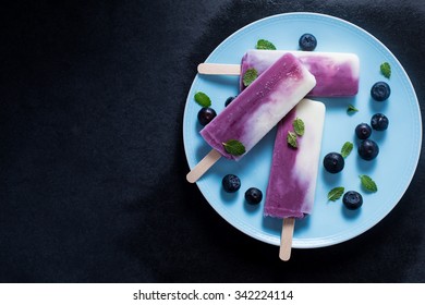 Yogurt And Blueberry Popsicle On Plate, Food Background