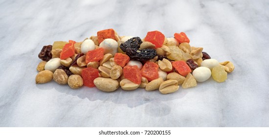 Yogurt Covered Raisin, Fruit And Nut Trail Mix On A Gray Marble Counter Top.