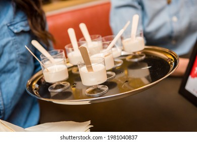 Yogurt Cups With Popsicle Stick On A Gold Serving Tray