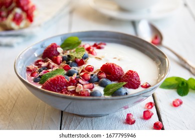 Yogurt With Fresh Fruit And Berries (raspberry, Pomegranate, Blueberry) And Mint For Healthy Breakfast