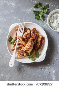 Yogurt Marinated Grilled Chicken Breast On A Gray Background, Top View