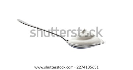 Yogurt spoon with creamy texture isolated