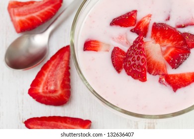 Yogurt With Strawberry In The Bowl With Spoon