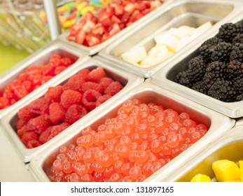 Ã?Â¢??Frozen Yogurt Toppings Bar. Yogurt Toppings Ranging From Fresh Fruits, Nuts, Fresh-cut Candies, Syrups And Sprinkles.