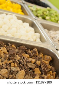 Ã?Â¢??Frozen Yogurt Toppings Bar. Yogurt Toppings Ranging From Fresh Fruits, Nuts, Fresh-cut Candies, Syrups And Sprinkles.