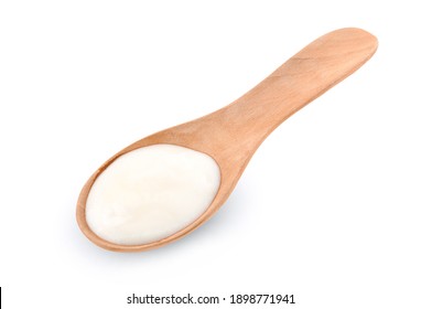 Yogurt In Wood Spoon Isolated On White Background