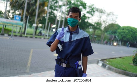 Yogyakarta 21 June 2020 - A Janitor Standing Wearing His Uniform And Mask And Glove