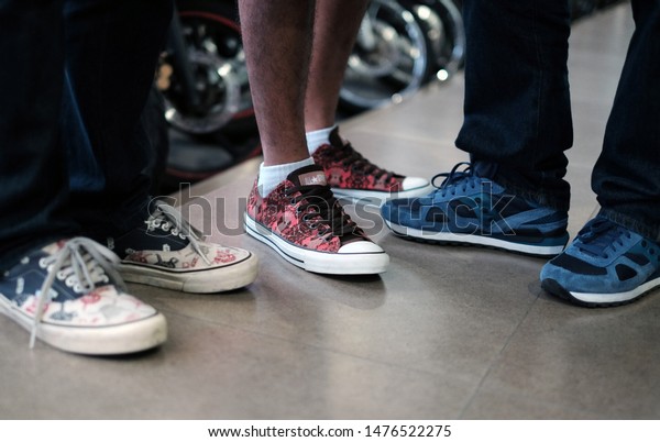 people wearing converse