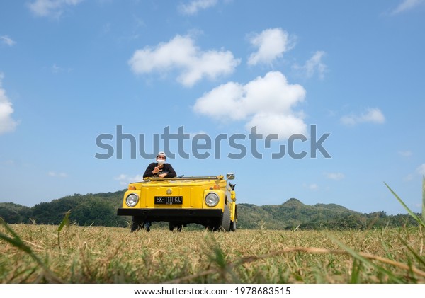 yogyakarta, ID - May 22 2021: Volkswagen Thing\
with people on\
vacation