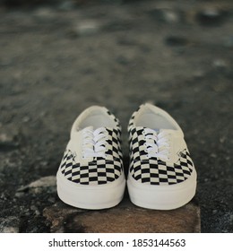 Yogyakarta, Indonesia - 22 November 2019: Vans Era CRFT Podium Checkerboard Shoes Series Products On A Rock Background.