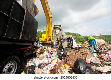 Yogyakarta, Indonesia - December 11, 2018: A Man Is Collecting Plastic Waste At The Piyungan Public Garbage Dump, Yogyakarta 