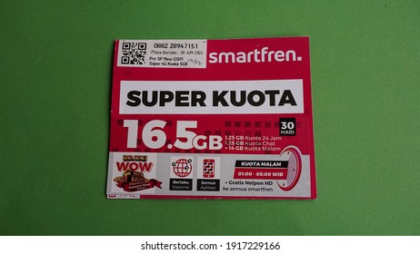 Yogyakarta, Indonesia - Feb 15th 2021 Prepaid Sim Card Package  Of Smartfren 16.5 GB Preloaded Internet Data Credit, From Smartfren Telecom Indonesia Cellular Operator Provider On Green Background