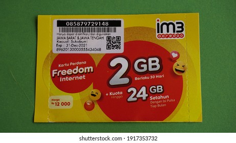 Yogyakarta, Indonesia Feb 15th 2021, Prepaid Im3 Sim Card Internet Package Preloaded With  2GB Data Credit From Indosat Ooredoo Company, Cellular Provider Operator From Qatar Telecom. Green Background