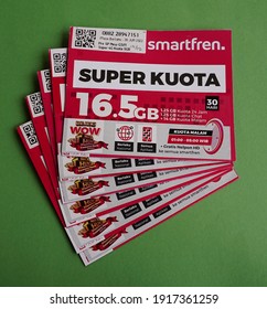 Yogyakarta, Indonesia - Feb 15th 2021 Pile or stack of Prepaid Sim card package  of Smartfren 16.5 GB preloaded internet data credit, from PT. Smartfren Telecom Indonesia cellular operator provider 