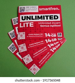 Yogyakarta, Indonesia - Feb 15th 2021 Pile Or Stack Of Prepaid Sim Card Package Of Smartfren Unlimited Preloaded Internet Data Credit, From PT. Smartfren Telecom Indonesia Cellular Operator Provider 