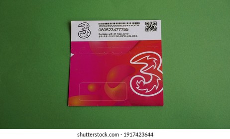 Yogyakarta, Indonesia Feb 15th 2021 Close Up View Of Prepaid Three Or Tri Regular Package Sim Card From Hutchison 3 Indonesia Company Isolated On Green Background