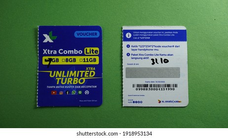 Yogyakarta, Indonesia Feb 17th 2021 Front and rear view of prepaid XL unlimited turbo internet package top up voucher from XL Axiata Indonesia company member of big asian cellular provider group