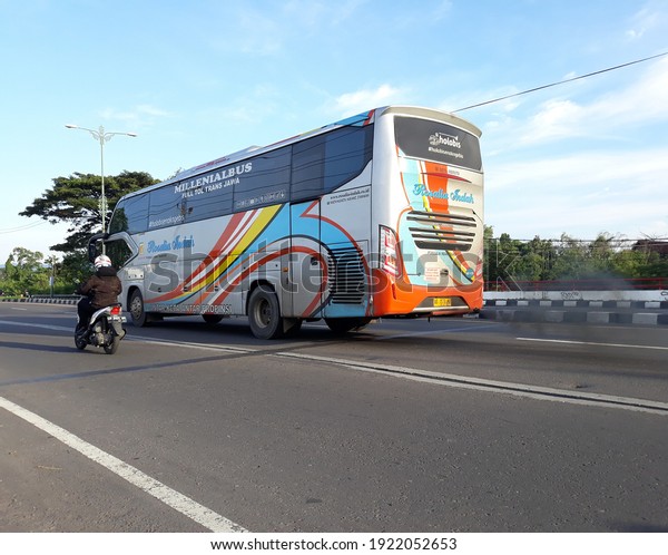 Yogyakarta, Indonesia,\
February 22, 2021. Bus passes on the way, bus angkutan umum lewat\
di jalanan ringroad kota yogyakarta, transportasi masayarakat dari\
dan keluar jogja