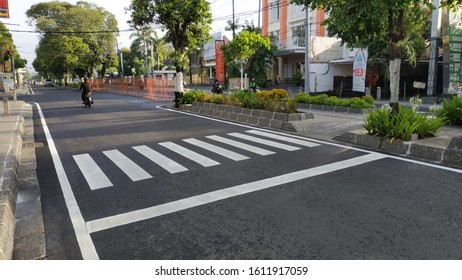 YOGYAKARTA, INDONESIA - JANUARY 11, 2020: Zebra Cross is a pedestrian crossing on a street that is destined for pedestrians who will cross the road - Shutterstock ID 1611917059
