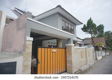 Yogyakarta, Indonesia - January 31 2020: Facade of a big house with grey wall colour. - Shutterstock ID 1907314570