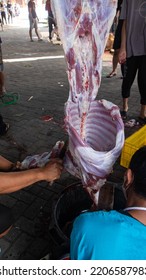 Yogyakarta, Indonesia - July 09, 2022: Slaughter Of Sacred Animals On Eid Al-Adha. Muslim People Are Slaughtering Sheep Or Goat As Sacred Animals On Eid Al-Adha Sacrifice.