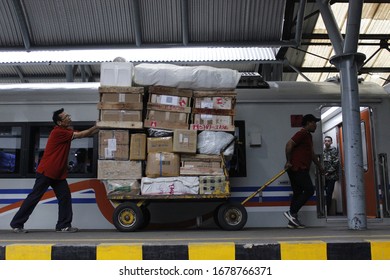 Yogyakarta, Indonesia - July 29, 2017: Loading goods from freight train at the station - Shutterstock ID 1678766371