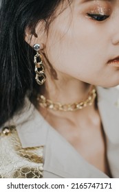 Yogyakarta Indonesia, June 16, 2019. Woman Wearing Gold Chain Earrings And Necklace Close Up