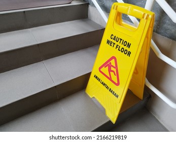 Yogyakarta, Indonesia. June 2, 2022. Yellow Signage Watch Out For Wet And Slippery Floors In An Office. Be Careful On Foot. Yellow Sign For Wet Floor. 