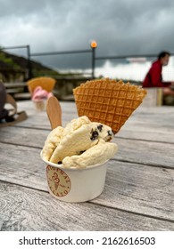 Yogyakarta, Indonesia - Mar 2022 : Two Cups Of Gelato Strawberry And Vanilla Flavor With Wafer Waffle On The Wooden Table