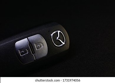 Yogyakarta, Indonesia - May 13 2020: Mazda logo in a car key, automotive brand, car brand, car brand logo in a key, car key