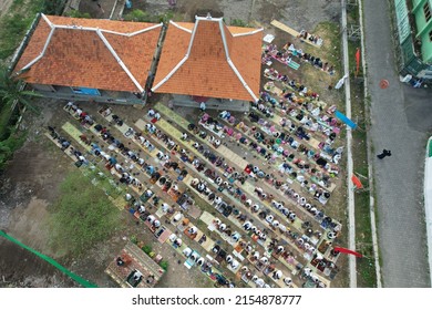 Yogyakarta, Indonesia. May 2, 2022. aerial view of Eid prayer in the field which was attended by hundreds of worshipers. Eid during the COVID-19 pandemic which requires worshipers to wear masks.