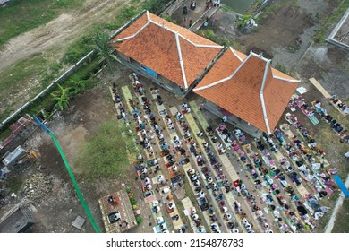Yogyakarta, Indonesia. May 2, 2022. aerial view of Eid prayer in the field which was attended by hundreds of worshipers. Eid during the COVID-19 pandemic which requires worshipers to wear masks.