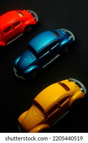 Yogyakarta, Indonesia - May 24, 2014 : Three Tomica VW Beetle Miniature Car With Black Background