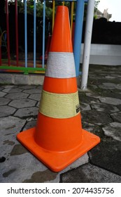 Yogyakarta, Indonesia - November 1, 2021: Traffic cone is a temporary traffic control device in the form of a cone made of plastic or rubber.