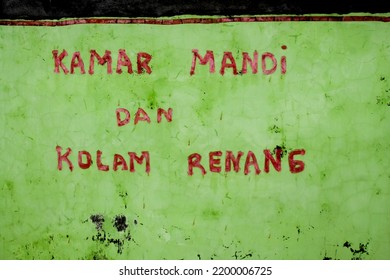 Yogyakarta, Indonesia - November 20, 2018: Wall With Painted Writing Bathroom And Swimming Pool