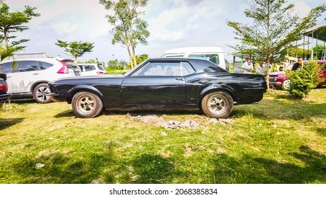 Yogyakarta Indonesia October 17 2021 A Black Ford Mustang Pony Car Parked On A Parking Lot During A Free Entry Event