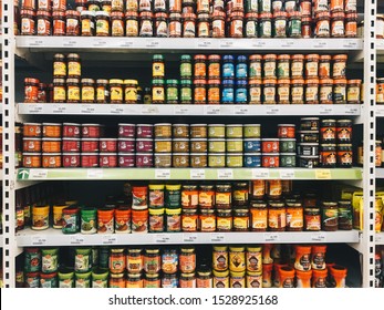 Yogyakarta, Indonesia - October, 2019: Variety brand of tomato and chili sauce the bottles in Indonesia on display rack at supermarket shelf.