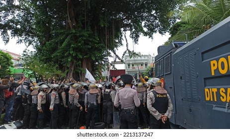 Yogyakarta, Indonesia – October 8 2020: POV From Behind A Heavily Armed Police Barricade Who Stood Confining Protesters At A Demonstration Against The Job Creation Law In Front Of The DPRD