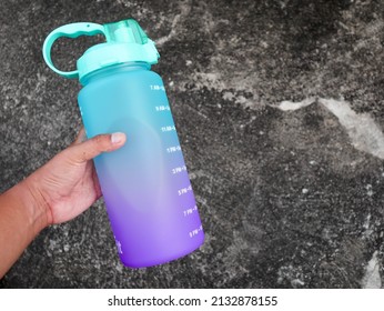 Yogyakarta - January 03 2022: A Hand Hold Big Colorful Sport Drinking Bottle That Can Contain 2 Litre Suitable For Hiking Or Diet