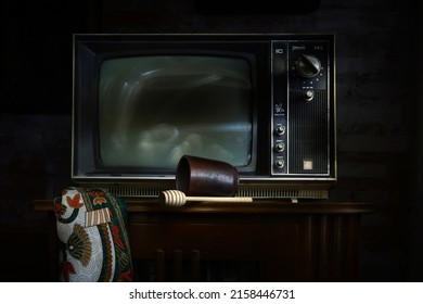 Yogyakarta, May 14, 2022. An Old Television On An Ethnic Table. Fine Art Photography. Light Painting Photography. Still Life Photography.                              