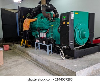 Yogyakarta,Indonesia,April 7,2022.a Technician Is Doing Regular Maintenance On The Generator Engine.