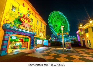 Yokohama, Japan - April 21, 2017: Cosmo World Amusement Park In Minato Mirai 21 District With Cosmo Clock 21, A Ferris Wheel. The Park Is Divided In: Kids Carnival Zone, Brano Street And Wonder Amuse.