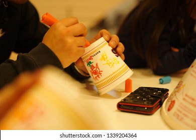 YOKOHAMA, JAPAN - JAN 20, 2019: Making a cup noodle step by step in Nissin cup noodle museum 