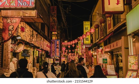 YOKOHAMA, JAPAN - Nov 07, 2021: A Beautiful Shot Of People Crossing Street In China City In Yokohama, Japan At Night