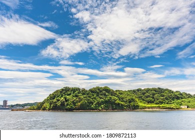 Yokosuka, Japan - July 19 2020: Azuma Island In The Yokosuka Naval Port Belonging To The US Navy Azuma Storage Area And Separating The Japan Self Denfence Fleet From The United States Seventh Fleet.