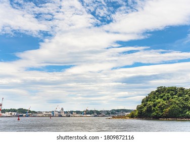 Yokosuka, Japan - July 19 2020: Azuma Island In The Yokosuka Naval Port Belonging To The US Navy Azuma Storage Area And Separating The Japan Self Denfence Fleet From The United States Seventh Fleet.