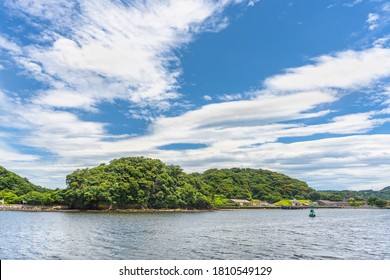 Yokosuka, Japan - July 19 2020: Azuma Island In The Yokosuka Naval Port Belonging To The US Navy Azuma Storage Area And Separating The Japan Self Denfence Fleet From The United States Seventh Fleet.