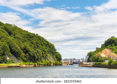 Yokosuka, Japan - July 19 2020: Arai Canal Waterway Between Azuma Island And Yokosuka City Separating The Japan Self Defence Fleet From The United States Seventh Fleet In The Yokosuka Naval Port.