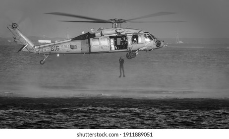 Yokosuka, Kanagawa, Japan - January 20, 2021: A US Navy MH-60 Helicopter Drops A Rescue Swimmer In To Tokyo Bay.